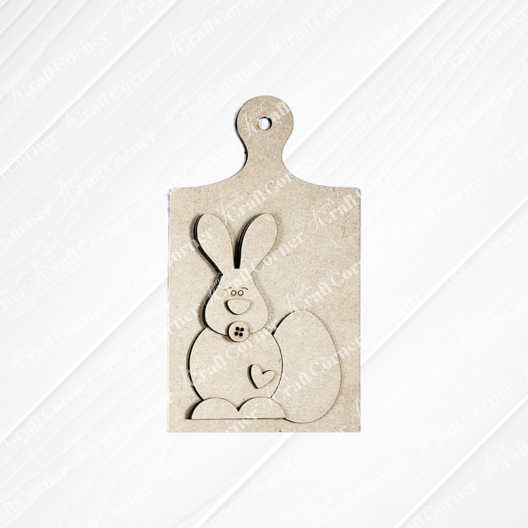 The Easter Decor Set from Janet's Craft Corner is a DIY seasonal home decor kit with five choices, featuring wooden pieces like a bunny with heart paw and button details—ideal for your handcrafted Easter decorations or projects.