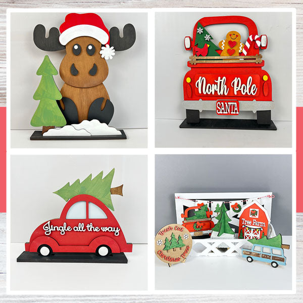 Festive decorations featuring a wooden moose with a Santa hat, a red truck with "North Pole" sign, a red car with a tree and "Jingle all the way," and a white display of a tree farm scene.