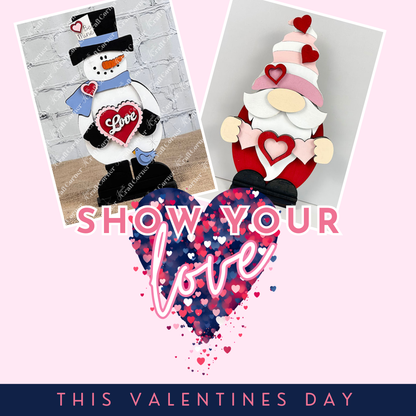 A Valentine's Day graphic features a snowman holding a "Love" sign and an adorable Valentine Gnome Shelf Sitter from Janet's Craft Corner, clutching a heart. "Show Your Love" is written above confetti-filled heart with "This Valentine's Day" below, perfect for whimsical home décor.