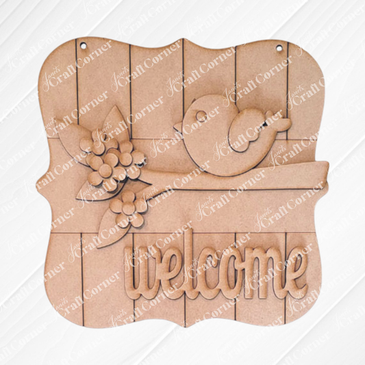 The Bird Welcome Sign by Janet's Craft Corner decorates the brick wall with a charming bird on a branch with flowers. "Welcome" is carved at the bottom of this rustic wooden plaque, ideal for any entryway. Available as a DIY seasonal home decor craft kit in a set of 1.