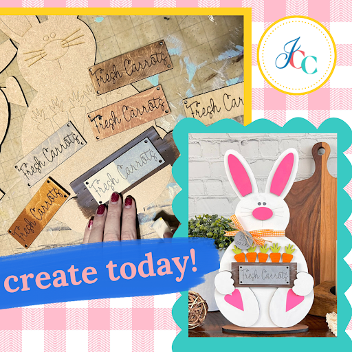 Create an Easter scene with the Carrot Patch Bunny Shelf Sitter from Janet's Craft Corner. The setup features wooden signs saying "Fresh Carrots" and decorative carrots, set on a gingham background. Complete your DIY seasonal home decor today! Logo in the corner adds a finishing touch.