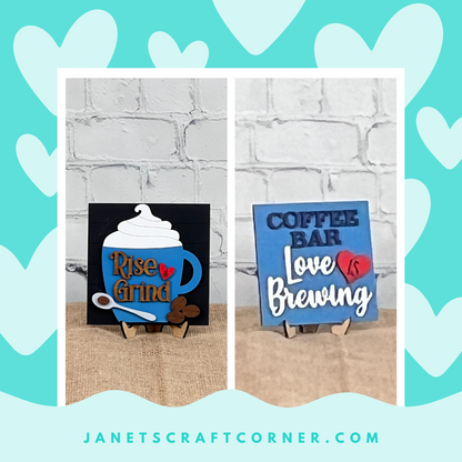 Janet’s Craft Corner Coffee Squares are two blue wood signs with 3D coffee décor. “Rise & Grind” features a cup, and “Coffee Bar, Love is Brewing” adds charm—perfect DIY seasonal accents for small spaces.