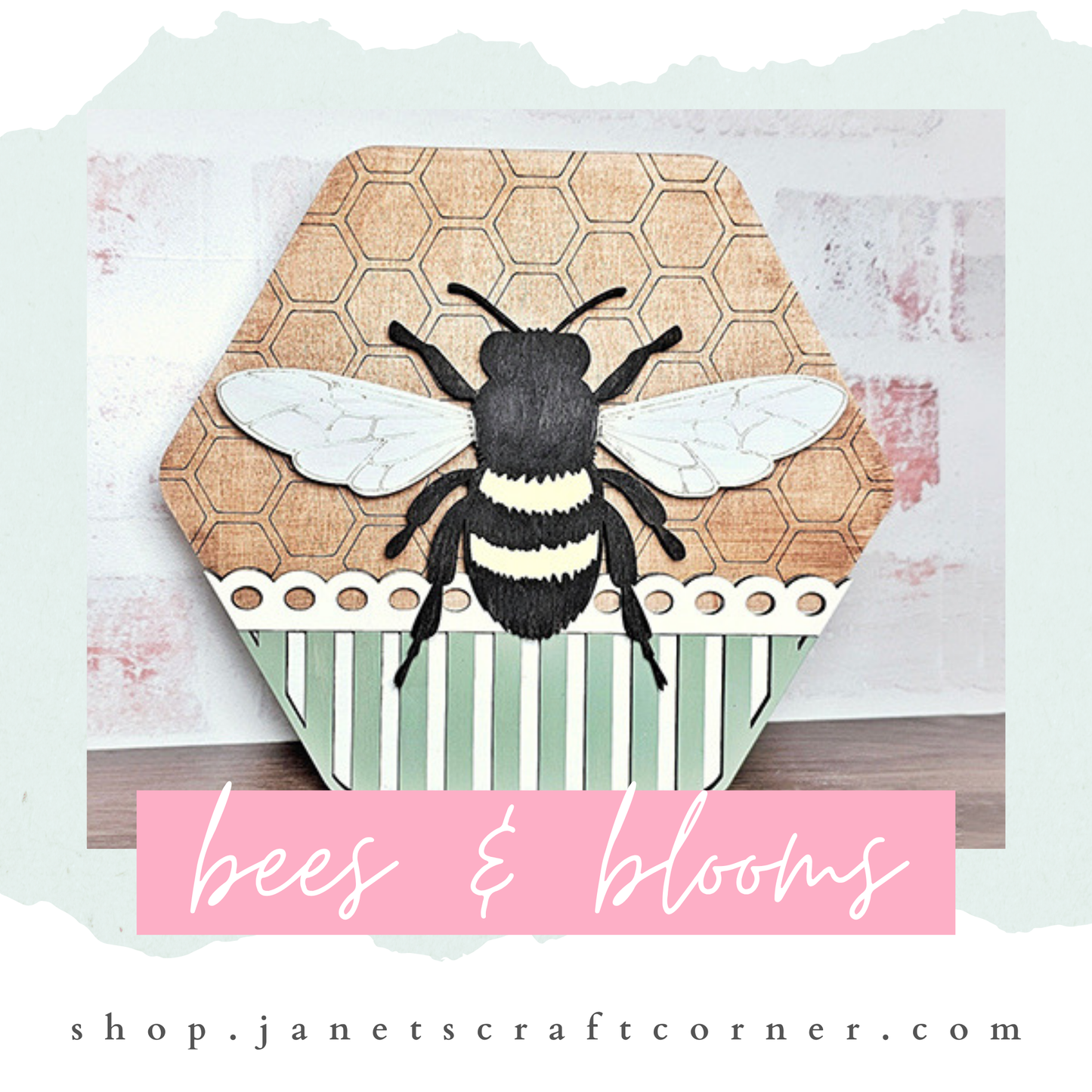 Discover Janet's Craft Corner's Honeycomb Shaped Bee Sign Door, featuring a bee and honeycomb design with green/white stripes and "bees & blooms" in pink on light brick texture. Ideal as a DIY decor craft kit! Visit shop.janetscraftcorner.com.