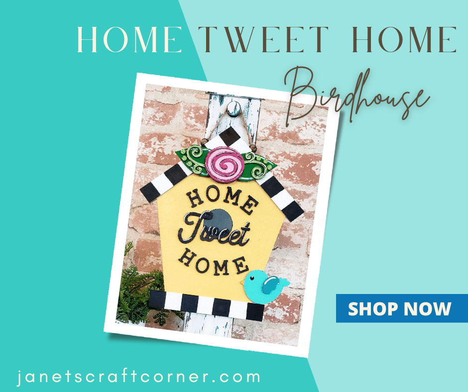 The Home Tweet Home Birdhouse Door Hanger by Janet's Craft Corner showcases "Home Tweet Home" in black on yellow, with pink swirls and a blue bird. Ideal for décor enthusiasts. Explore further by clicking "Shop Now" at janetscraftcorner.com.