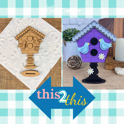 Split image showing two birdhouse designs. Left: Unpainted wooden from Janet's Craft Corner, ideal for DIY Kit lovers. Right: Painted version—purple roof, blue birds, white flower, black stand. Blue arrow labeled "this 2 this" in center; plaid background appeals to gnome enthusiasts.