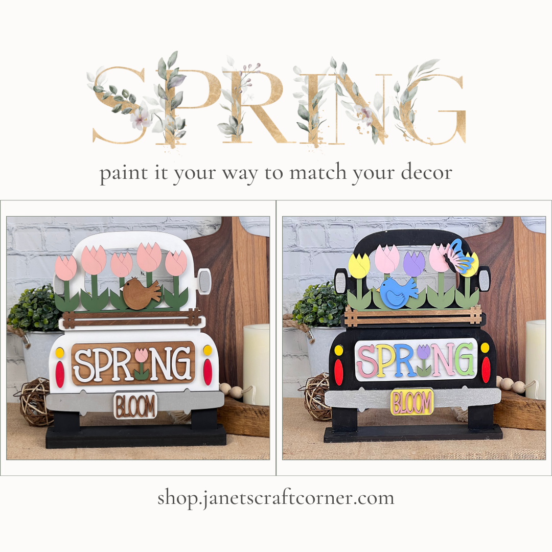 Janet's Craft Corner offers a DIY home decor kit called the Spring Tulips Interchangeable Insert, featuring two designs with a decorative truck carrying flowers and the words "SPRING BLOOM." One design showcases a white background with pastel shades, while the other has a darker backdrop accentuated by vibrant colors. This hand-painted craft kit includes interchangeable inserts that seamlessly blend with your home's decor.