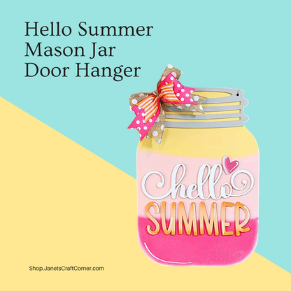 A Hello Summer Mason Jar Door Hanger from Janet's Craft Corner is shown on a pastel teal and yellow background. The pink and yellow jar, adorned with "Hello Summer" and a heart, features a charming pink bow with white polka dots at the top.