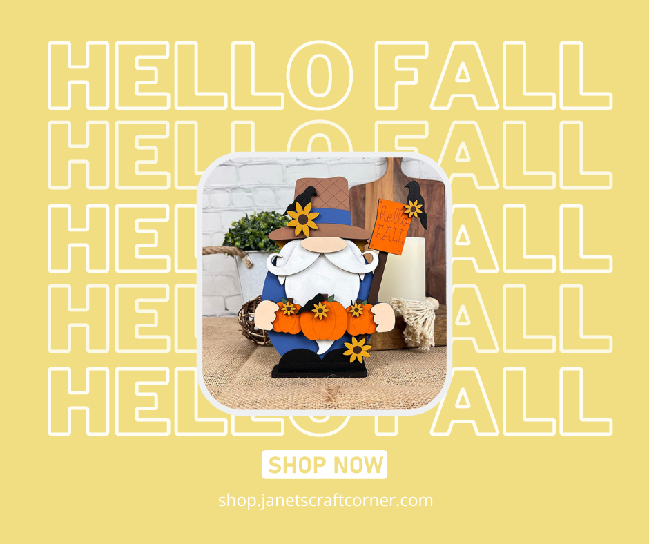 Check out Janet's Craft Corner for the Scarecrow Gnome Shelf Sitter, a DIY seasonal home decor craft kit featuring an orange pumpkin, black hat, and yellow flowers with "HELLO FALL" in the background. Perfect for décor enthusiasts. Click "SHOP NOW" on our website for more!.