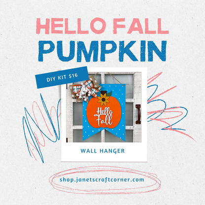 The image displays an ad for Janet's Craft Corner's handcrafted "Hello Fall" wall hanger DIY kit, ideal for autumn decor. Priced at $16, it features a colorful scribbled background. Find more info at shop.janetscraftcorner.com.