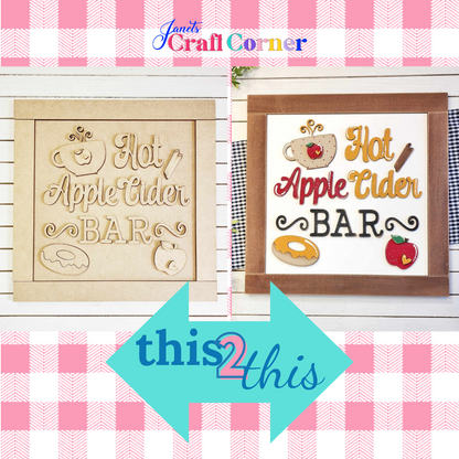 Split image of "Apple Cider Bar" signs ideal for home décor: Left shows an unfinished wooden sign with carved icons, and the right, a vibrant painted sign. Both against a pink checkered background. Perfect as Janet's Craft Corner DIY craft kit!.