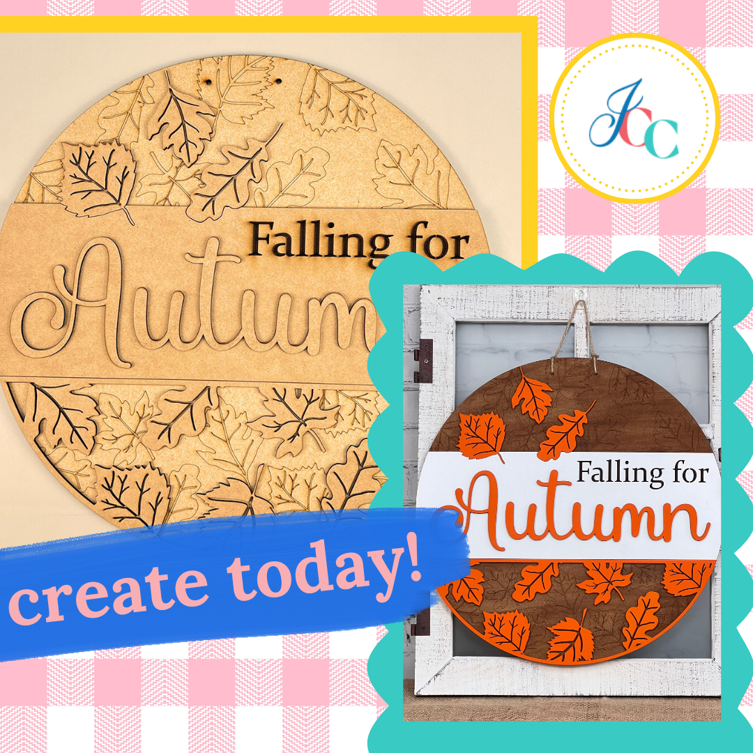 The "Falling for Autumn Round" DIY craft kit from Janet's Craft Corner brings to life a vibrant wooden sign with engraved oak leaves and the phrase "Falling for Autumn," featuring bold hand-painted autumn colors, a "create today!" blue ribbon, against a pink and white checkered backdrop.