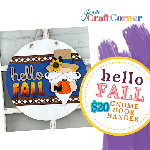 Round gnome-themed door hanger on a blue background, featuring "hello FALL" text and a gnome holding a pumpkin. Promo: "Hello Fall Gnome Door Hanger DIY Kit" for $20 with Janet's Craft Corner logo—a perfect seasonal home décor craft kit!.