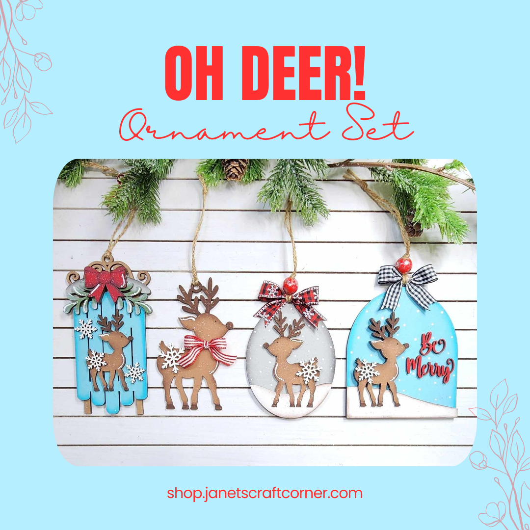 Image of four unique reindeer-shaped handmade ornaments, each with bows, hanging against a rustic white wood backdrop with pine branches above. Text reads "Oh Deer Ornaments - Set of 4" by Janet's Craft Corner, ideal for charming holiday decor.