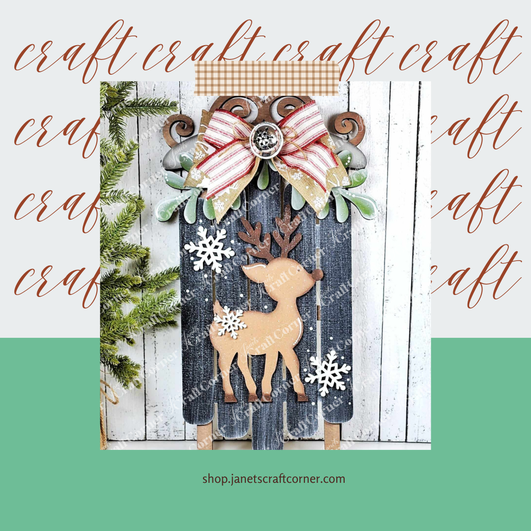 The Oh Deer Sled Wall Hanger from Janet's Craft Corner adds charm to your festive decor with reindeer and snowflakes on a rustic backdrop. Finished with a red-striped bow and greenery, it's perfect for DIY enthusiasts. Discover it at shop.janetscraftcorner.com.