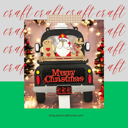 The "Merry Christmas Interchangeable Insert" by Janet's Craft Corner features Santa, a reindeer, and a gingerbread man on a black truck with "Merry Christmas" and "Ho Ho Ho" signs. This hand-painted DIY craft kit is ideal for festive home decor amidst twinkling lights and trees.