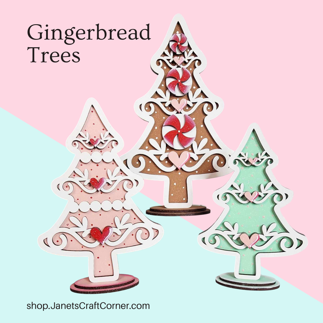 A set of three decorative Gingerbread Christmas Trees in brown, pink, and green with candy and icing designs on a pastel pink and green background. Text: "Gingerbread Trees" from Janet's Craft Corner at shop.JanetsCraftCorner.com, perfect for festive home decor or a DIY craft kit.