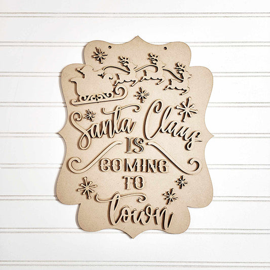 Add holiday charm with the "Santa Claus is Coming to Town Wall Hanger" by Janet's Craft Corner. This festive decor features wooden silhouettes of Santa's sleigh and reindeer atop cursive text, accented with snowflakes. Ideal as a santa door hanger from this DIY seasonal decor craft kit.