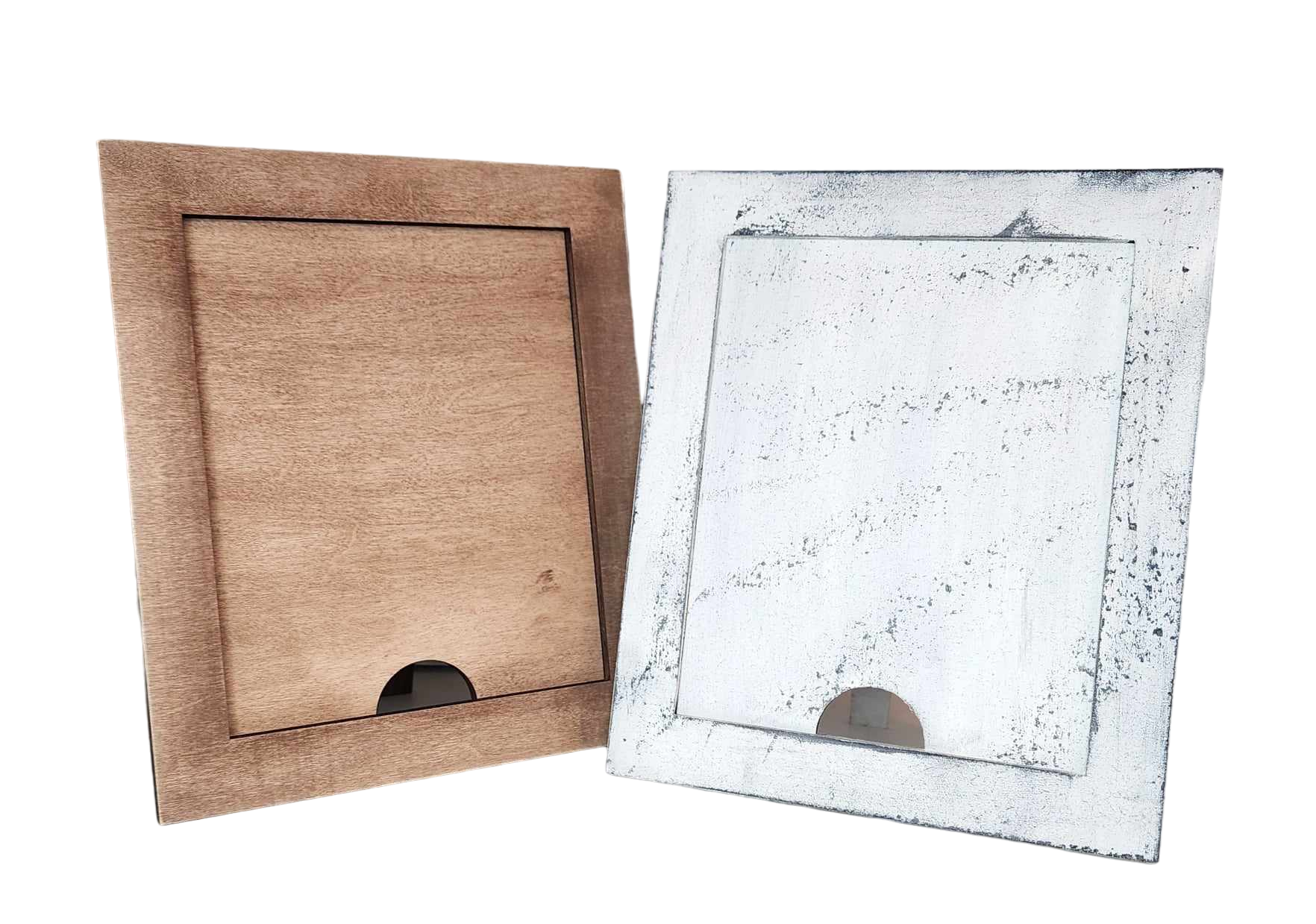 Against a black background, two empty photo frames are displayed side by side. The left frame is crafted from light brown wood, while the right frame belongs to Janet's Craft Corner and is named the "Simple Farmhouse Frame for Interchangeable Signs," showcasing a white weathered finish ideal for farmhouse decor. Both frames feature a small semicircular cutout at the bottom.