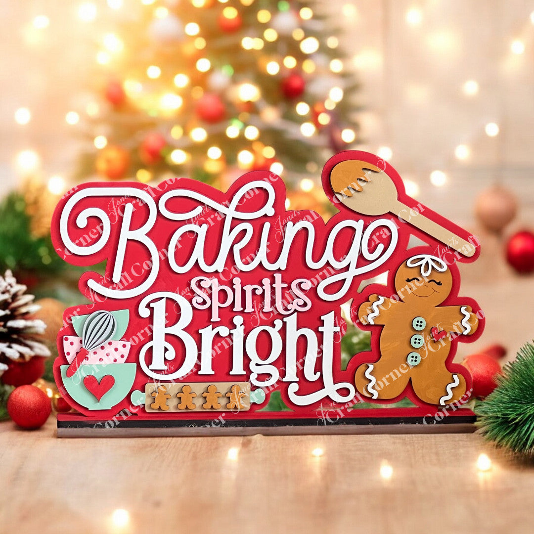 The "Baking Spirits Bright Shelf Sitter" by Janet's Craft Corner is a festive DIY home decor kit featuring a hand-painted gingerbread man, spoon, and mixing bowl. Perfect for creating an inviting holiday atmosphere with twinkling lights and a Christmas tree backdrop.