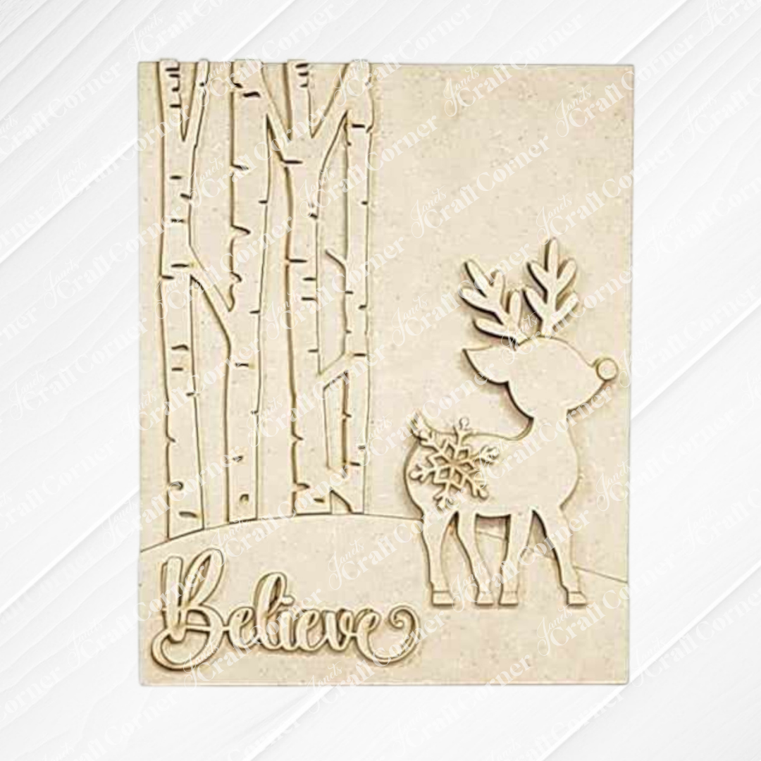 Introducing the Oh Deer Believe Farmhouse Sign from Janet's Craft Corner: a delightful DIY craft kit. Featuring a reindeer adorned with a snowflake next to stylized tree trunks and the word "Believe" elegantly carved at the bottom in cursive, it’s an ideal addition to your farmhouse-inspired home decor.