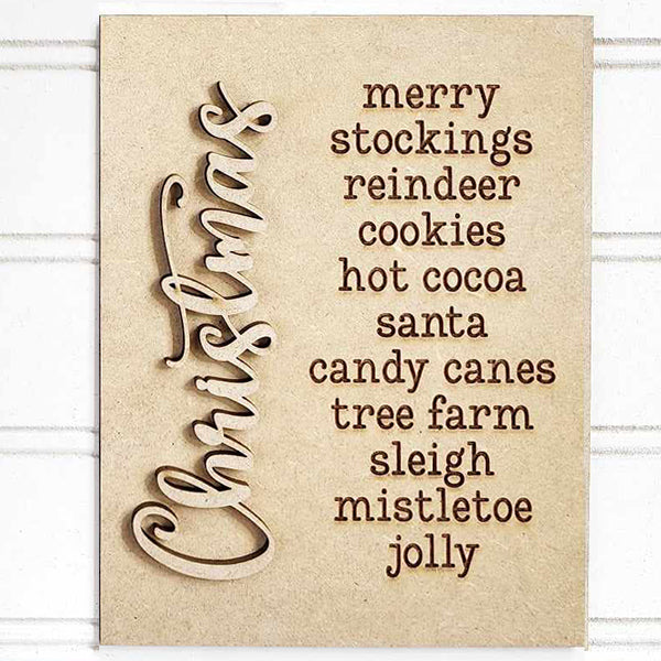 Introducing the Christmas Words Interchangeable Sign by Janet's Craft Corner, a DIY home decor craft kit featuring a wooden board with "Christmas" elegantly written in cursive on the left side. The right side showcases a selection of interchangeable holiday words such as merry, stockings, reindeer, cookies, hot cocoa, Santa, candy canes, tree farm, sleigh, mistletoe and jolly.