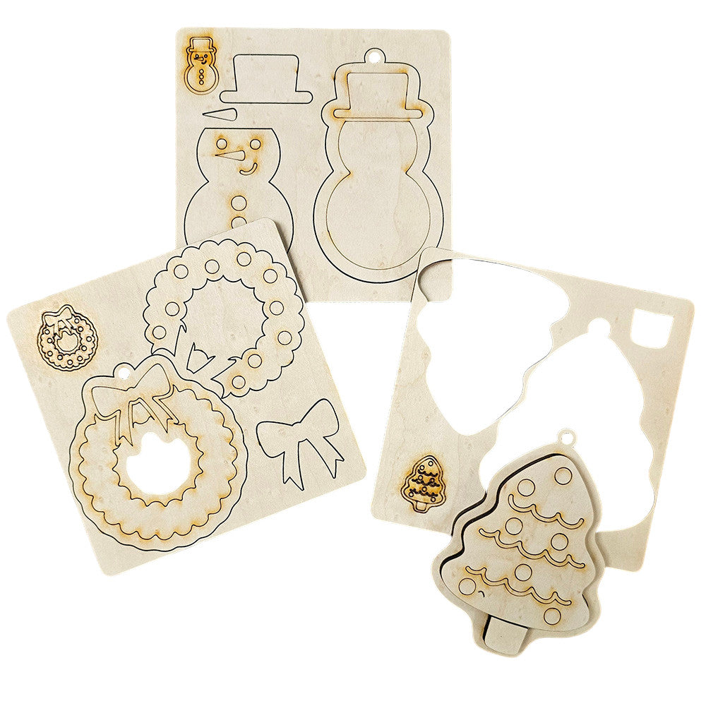 The Sugar Cookie Ornaments - Set of 3 DIY Decoration Kits from Janet's Craft Corner include festive cutouts: snowman, wreath, bow, and tree. Each piece is designed to fit perfectly into its outlined board, making them ready for you to decorate. Bring a personalized charm to your home décor with this delightful craft set.