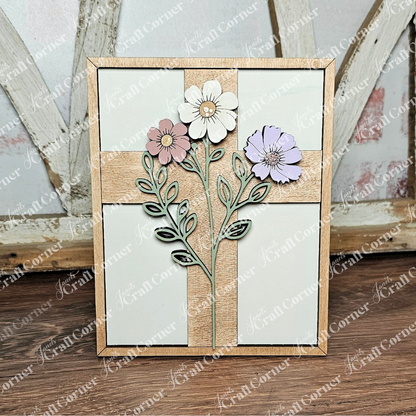 This "Easter Flowers Farmhouse Sign" by Janet's Craft Corner is perfect for small spaces, featuring three flowers with green stems and leaves in a cross shape. Set against a light background with a wooden frame, it's watermarked elegantly—ideal for DIY seasonal home decor.