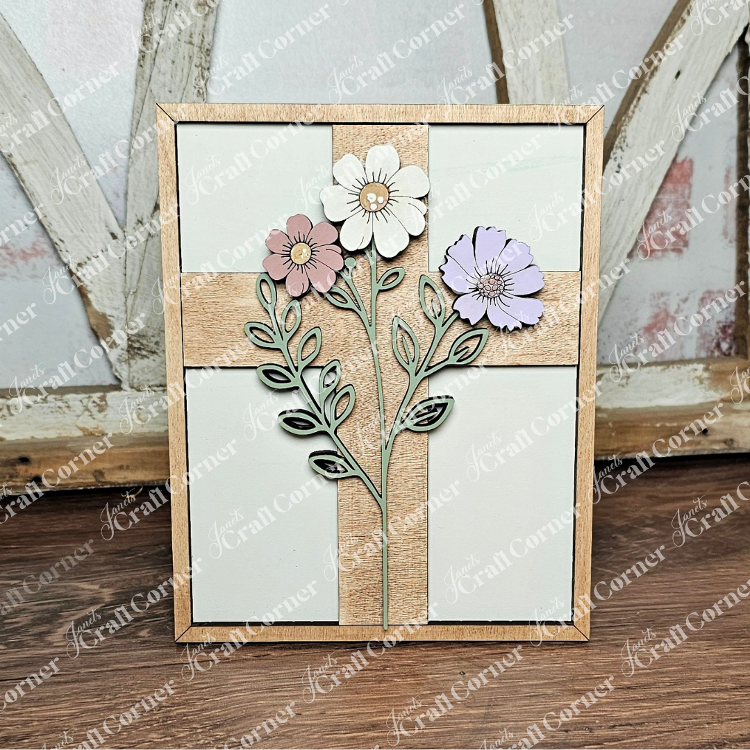 Pair Janet's Craft Corner’s Easter Switchable Farmhouse Signs—Spring DIY Craft Kit, one of 4 designs—with pastel flowers on a wooden cross for a charming look on your wooden table or among farmhouse decor.