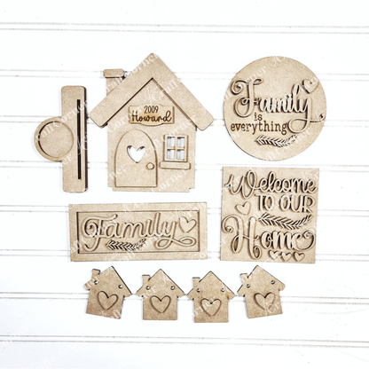 The Family Home Decor Set by Janet's Craft Corner features charming wooden pieces: a "2009 Howard" house, "Family is everything" round, and "Welcome to our Home" rectangle. Perfect for DIY crafts, these personalized charms beautifully embody home décor.