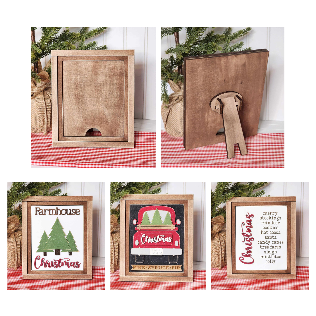 Janet's Craft Corner offers the Farmhouse Frame for Interchangeable Signs, a DIY home decor craft kit featuring five wooden Christmas decorations. Two are simple panels with stands and notches, while three include a farmhouse scene, red truck with trees, and holiday words—ideal for festive charm.