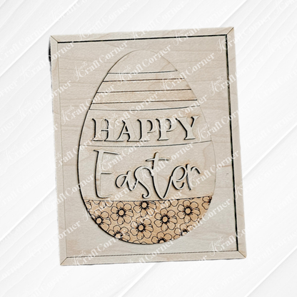 Janet's Craft Corner offers the Easter Egg Farmhouse Sign: a wooden plaque with "Happy Easter" carved in an egg shape. It features floral patterns and a subtle diagonal stripe texture, ideal for DIY seasonal home decor or as charming wood cut-outs for your craft kit.