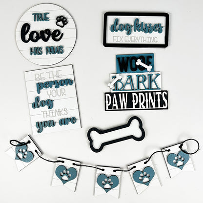 Create the ultimate dog lover decor with Janet's Craft Corner's Dog Lover Tiered Tray Kit. This kit includes charming phrases such as "True love has paws" and "Dog kisses fix everything," accompanied by a paw print banner and bone-shaped decorations in stylish black, white, and teal. It's the perfect DIY home decor project for any enthusiast looking to add a canine touch to their crafts.