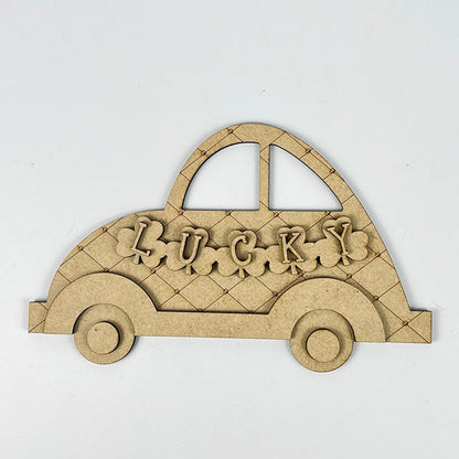 The "Lucky St. Patrick's Volkswagen Shelf Sitter" by Janet's Craft Corner is a wooden cutout with a lattice pattern, circular wheels, an arch-shaped roof, and "LUCKY" on the side. It adds charm to your St. Patrick's Day decor against a plain white background.