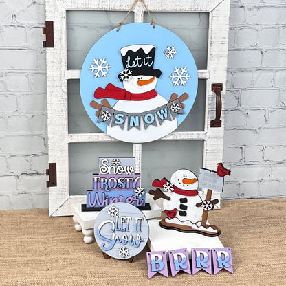 Introducing an enchanting selection of holiday decorations from Janet's Craft Corner, including the "Snowman Let It Snow" door hanger, delightful signs reading "Snow" and "Frosty Winter," and a cute snowman sledding with the phrase "Winter is for Sledding." These pieces are perfect for adding a touch of whimsy to your DIY kit.