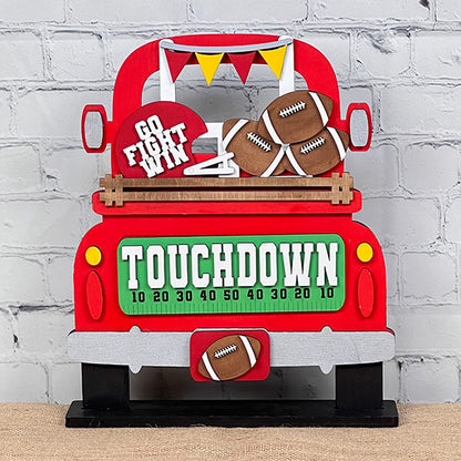 Introducing the Football Interchangeable Insert DIY home decor kit by Janet's Craft Corner: This charming red truck set showcases football-themed accents, including interchangeable footballs, helmets with "Go Fight Win," a goalpost, and a "Touchdown" sign. Perfectly set against a white brick wall backdrop, it offers an ideal project for hand-painted DIY craft enthusiasts looking to add a personal touch to their decor.