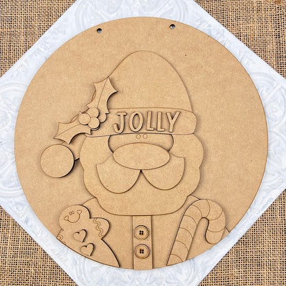 The Jolly Santa Round Sign from Janet's Craft Corner is a delightful holiday decoration. This DIY Home Decor Kit features a wooden cutout of Santa with "Jolly" on his hat, highlighted by holly accents. Santa holds a gingerbread man and candy cane against a burlap-textured background, making it an ideal choice for your hand-painted craft project!