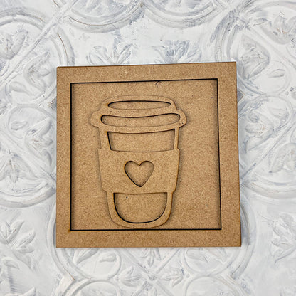 Coffee Squares by Janet's Craft Corner: A brown square cardboard with a to-go coffee cup cutout featuring a heart on the sleeve—ideal for DIY home decor. Set against a white, textured, decorative background.