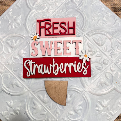 Janet's Craft Corner Word Stacks - Painted features a decorative sign with "FRESH SWEET Strawberries" in red, pink, and white on textured white, accented by daisies and a semicircular wooden piece at the bottom.