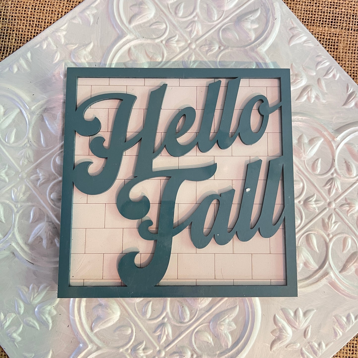 Janet's Craft Corner 6 inch squares feature a decorative sign with "Hello Fall" in large, cursive letters on a textured white patterned background.