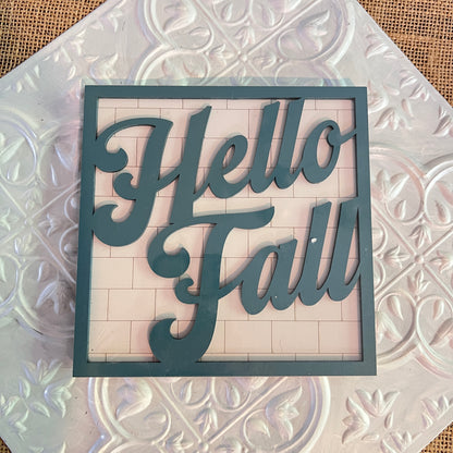 Janet's Craft Corner 6 inch squares feature a decorative sign with "Hello Fall" in large, cursive letters on a textured white patterned background.
