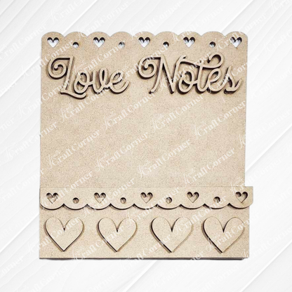 The Valentine Love Letters Decor Set by Janet's Craft Corner is a charming wooden plaque with "Love Notes" at the top, heart cutouts along the edges and bottom, and a small shelf for holding notes, adding personalized charm to your home décor.