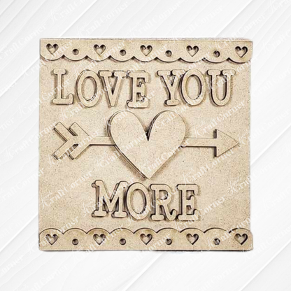 The Valentine Love Letters Decor Set by Janet's Craft Corner features "LOVE YOU MORE" with a heart and arrow design, framed by small hearts on textured beige—ideal for home décor or DIY inspiration.