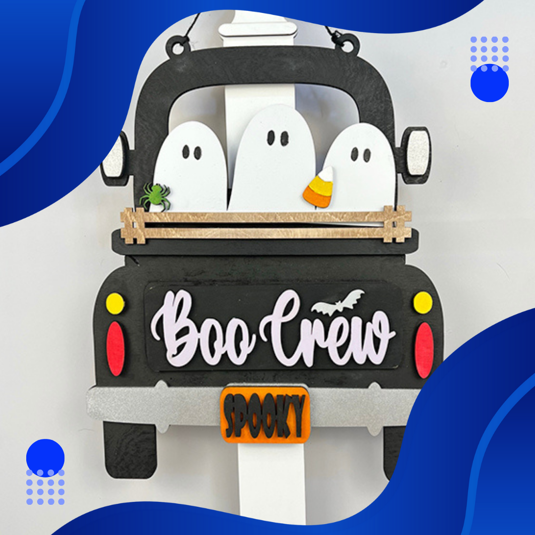 Janet's Craft Corner offers the "Boo Crew" interchangeable insert, featuring three white ghosts in a black truck with "Boo Crew" text and a bat. An orange sign reading "Spooky," accompanied by a green spider and candy corn, makes it perfect for your spooky decor. Includes 1 set of 3 pieces.