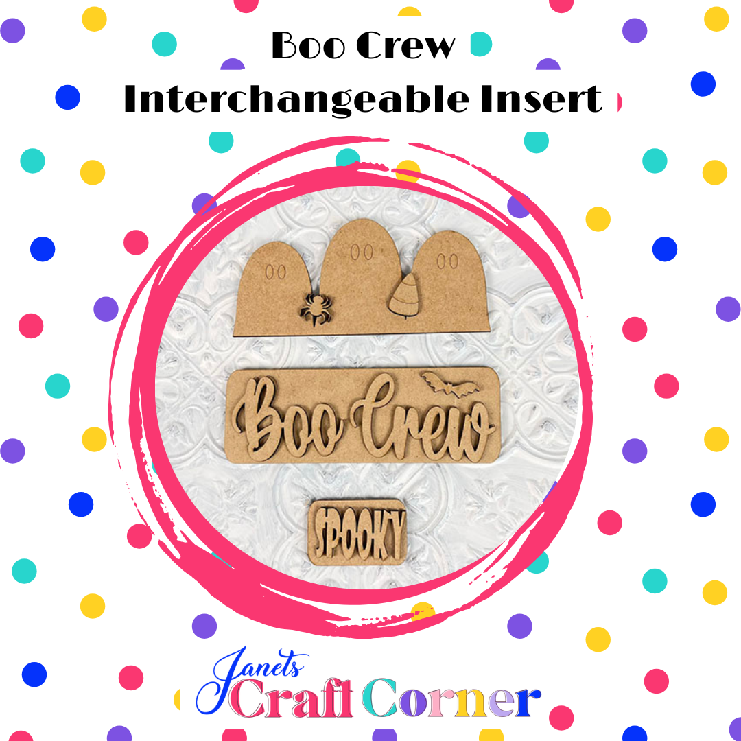 The Boo Crew interchangeable insert from Janet's Craft Corner features tombstones, a playful bat, and 'Boo Crew' & 'Spooky' text within a pink circle with colorful dots on a white background.