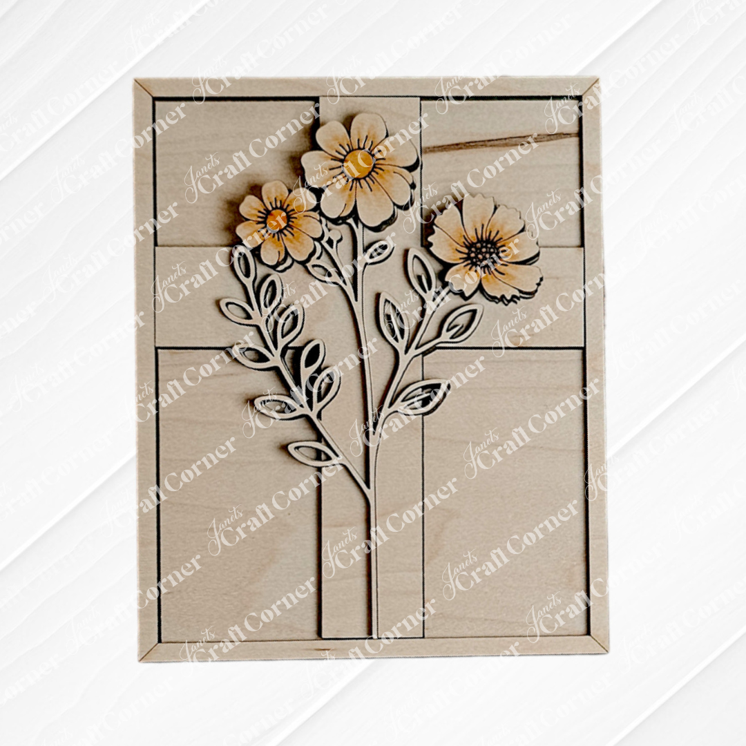 The Easter Flowers Farmhouse Sign by Janet's Craft Corner features intricate wooden cut-outs of three orange flowers and green leaves on a light geometric background. Ideal as a seasonal craft kit, it's perfect for DIY home decor enthusiasts.