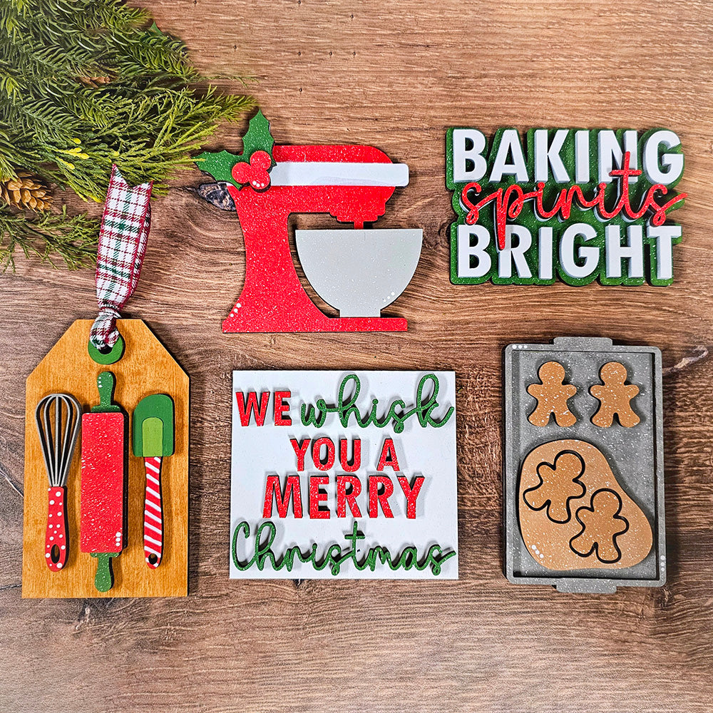 Infuse your holiday festivities with the cheerful vibe of Janet's Craft Corner's Baking Spirits Bright Decor Set. This 5-piece DIY home decor kit includes a vibrant red mixer, a charming "Baking Spirits Bright" sign, and an adorable gingerbread tray. Enhance the holiday atmosphere with a delightful "We Whisk You a Merry Christmas" sign, a rustic wooden tag adorned with utensils, and elegantly wrapped pine branches in plaid ribbon—a perfect choice for those who adore festive home decorating.