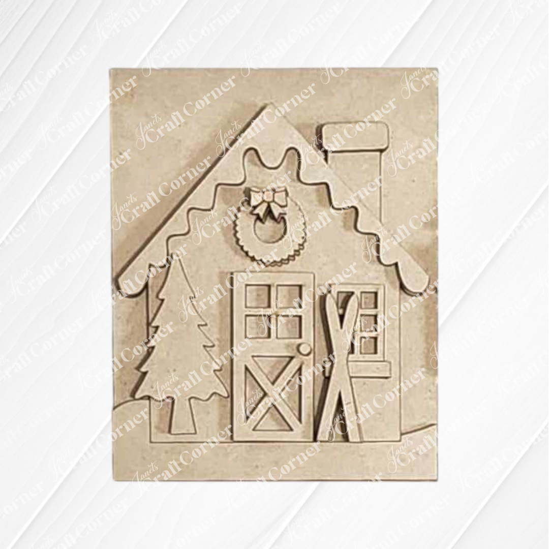 The Winter Cabin Sign by Janet's Craft Corner is a delightful DIY Craft Kit featuring a decorative wooden plaque that showcases a cozy winter cabin. It includes details like a wreath above the door, a snow-covered roof, skis leaning against the wall, and is complete with a Christmas tree adding festive cheer against subtle diagonal patterns.