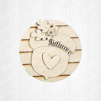 Add autumn charm to your home with Janet's Craft Corner Fall Harvest Mini Shelf Sitters DIY kit—a wooden acorn cutout with heart, "Autumn," oak leaves, and button. Perfect seasonal decor for shelves! Set of 1 included.