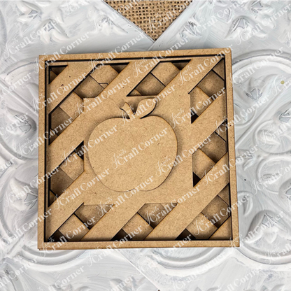 The Apple on Lattice Square by Janet's Craft Corner is a square, unfinished wooden cut-out with a lattice pie design and central apple. Perfect for DIY seasonal decor, it’s displayed on white textured patterns and burlap—ideal for small spaces.