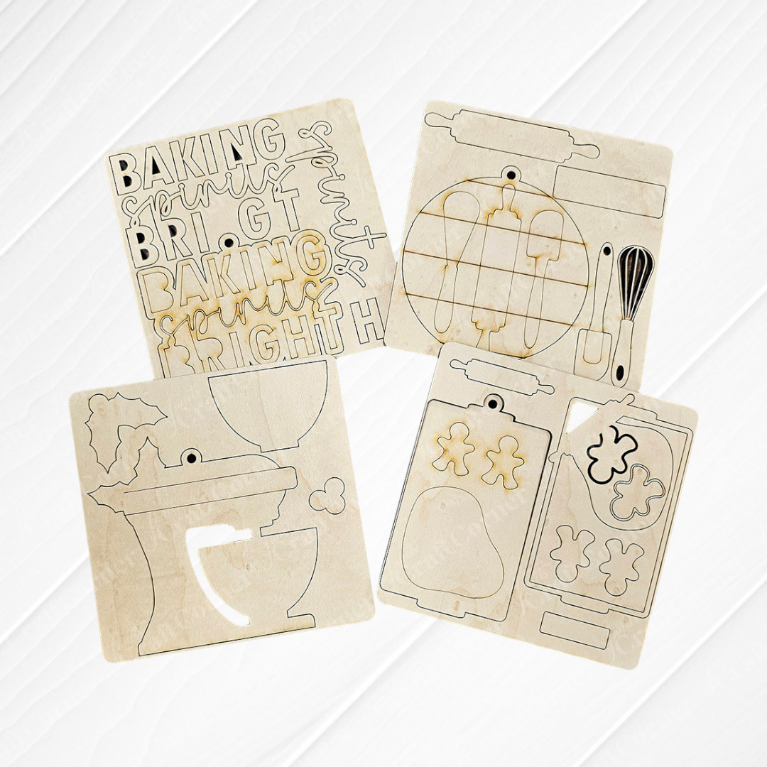 The "Baking Spirits Bright Ornaments" DIY kit by Janet's Craft Corner comes with four wooden stencil sheets featuring baking-themed designs. These patterns, which include rolling pins, a whisk, baking words, a mixer, and cookie shapes like gingerbread figures and a pear, are perfect for crafting hand-painted ornaments or distinctive holiday decor.